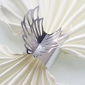 Detail of silver hollow butterfly wing napkin ring on white satin fabric for table decor - 20cm / Mirror Silver