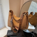 Vintage brown canvas tote bag with leather strap and TCT logo for casual daily wear - Caramel color