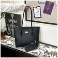 Close-up of black herringbone tote bag featuring small pouch and metallic logo plate - Black