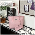 Detail of pink chevron tote bag and matching small pouch with elegant metal logo - Pink