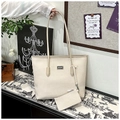 Detailed close-up of cream chevron patterned tote bag with a matching small coin purse - Off White