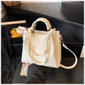Creamy white bucket bag with crocodile texture, top handles and adjustable shoulder strap - White