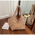 Close-up of beige crochet tote bag with openwork knit and yellow wavy accent line - Khaki With Yellow