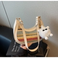 Detail of colorful striped woven straw bag with cream leather trim and plush charm - Off-white