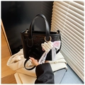 Black butterfly embossed bucket bag with pearl heart charm and lace bow handle - Black with Pendant