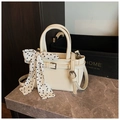Creamy white leather crossbody bag with polka dot scarf detail and silver buckle - White
