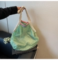 Detail of green woven cotton mesh bag with pink trim and wide cream shoulder strap - Green