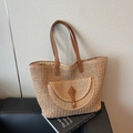 Light brown woven straw tote bag with brown leather straps and front pocket detail - Khaki