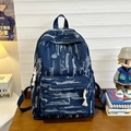 Retro denim backpack with white tie-dye stripes and durable rope fringe zippers - Dark Blue
