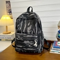 Tiger camo denim backpack with fringe tassel drawstring in black and grey woven pattern - Black