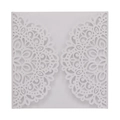 Detail showing intricate laser-cut lace mandala pattern on white wedding invitation card - White