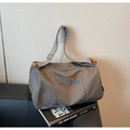 Detail of grey canvas tote bag with embroidered logo and premium brown leather piping - Dark Gray