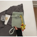 Light green lychee grain bucket bag with a cute yellow duck pendant and leather handle - With Charm / Green