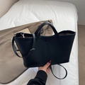 Black pebble leather tote bag with dual handles and adjustable shoulder strap - Black