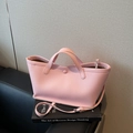 Pale pink lychee grain leather bucket bag with double handles and adjustable strap - Pink