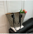 Large woven tote bag with black and beige geometric patterns and leather straps - Black