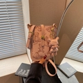 Pink lychee grain leather phone bag with brown teddy bear print and bear charm - Pink with Pendant