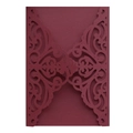 Close-up of laser-cut burgundy invitation cover with intricate floral vine patterns - Dark Red
