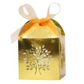 Close-up of golden hollowed tree candy box with an orange satin ribbon bow - Reflective Gold
