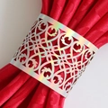 Close-up of laser-cut silver holographic napkin ring with ornate vine patterns on red silk - 17cm / Mirror Iridescent