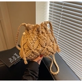 Close-up of Macramé woven bucket bag with intricate geometric patterns and drawstring - Khaki