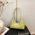 Detail of light green crocodile embossed leather underarm bag with silver hardware - Vintage Green