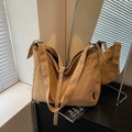 Minimalist khaki canvas tote bag with wide eyelet strap and large storage capacity - Khaki