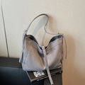Minimalist medium grey canvas hobo bag with wide shoulder strap and metal buckle - Gray