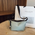 Minimalist mint blue nylon dumpling crossbody bag with adjustable black logo strap - Blue Small