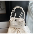 Creamy white multi-layered shoulder bag with decorative belt and unique circular handles - Off White