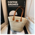 Straw tote bag with brown leather handles and brand patch in a stylish beige finish - White