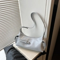 Minimalist light greyish blue crossbody dumpling bag with side flap pockets and glossy finish - Blue