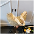 Detail of hand-woven beige crescent bag with a wide adjustable cream shoulder strap - Off White