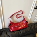 Chic vibrant red glossy shoulder bag with multiple pockets and utility style design - Red