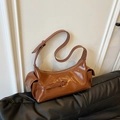 Chic brown high-gloss dumpling shoulder bag with wide strap and side pockets - Brown