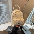 Cream quilted mini backpack with rhinestone accents and silver chain strap - Off-white