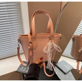 Pink woven straw tote bag with lace pearl charm and adjustable shoulder strap - Pink