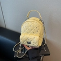 Quilted light yellow mini backpack bag with rhinestone accents and chain strap - Yellow