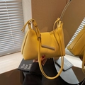 Minimalist bright yellow PU leather crossbody bag with a sleek metal bar and triangular flap - Yellow