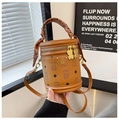Brown barrel bucket bag with bear patterns and silk scarf handle accessory - Tan