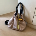 Detail of waterproof nylon drawstring backpack with cute plush dachshund charm - Khaki (With Charm)