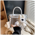 Detail of silver bucket bag with cracked texture and a cute white plush bear charm - Silver (With Pendant)