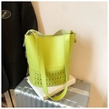 Lime green leather bucket bag with hollow pattern detailing and adjustable shoulder strap - Green