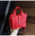 Red lychee pattern leather bucket bag with silver buckle and adjustable strap - Red