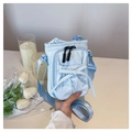 Light blue mini crossbody bag with cute bow detail and adjustable shoulder strap - Blue