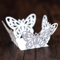 Intricate laser-cut white butterfly paper favor box with hollow floral patterns for weddings - White