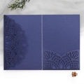 Navy blue laser-cut floral invitation cover with pearlescent finish on white background - Magic Blue