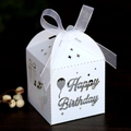 Close-up of laser-cut Happy Birthday favor box in white paper with organza ribbon - White