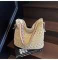 Off-white woven tote bag with colorful geometric strap and bow detail on a staircase - Style 2 Creamy White
