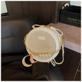 Circular woven straw crossbody bag in beige and white with pearl chain strap detail - Off White